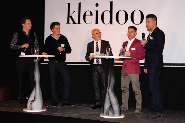 Feodor on stage presenting during the KleidOO startup period.